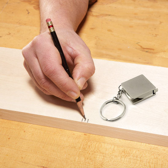 ruban metre utilisation exemple crayon
